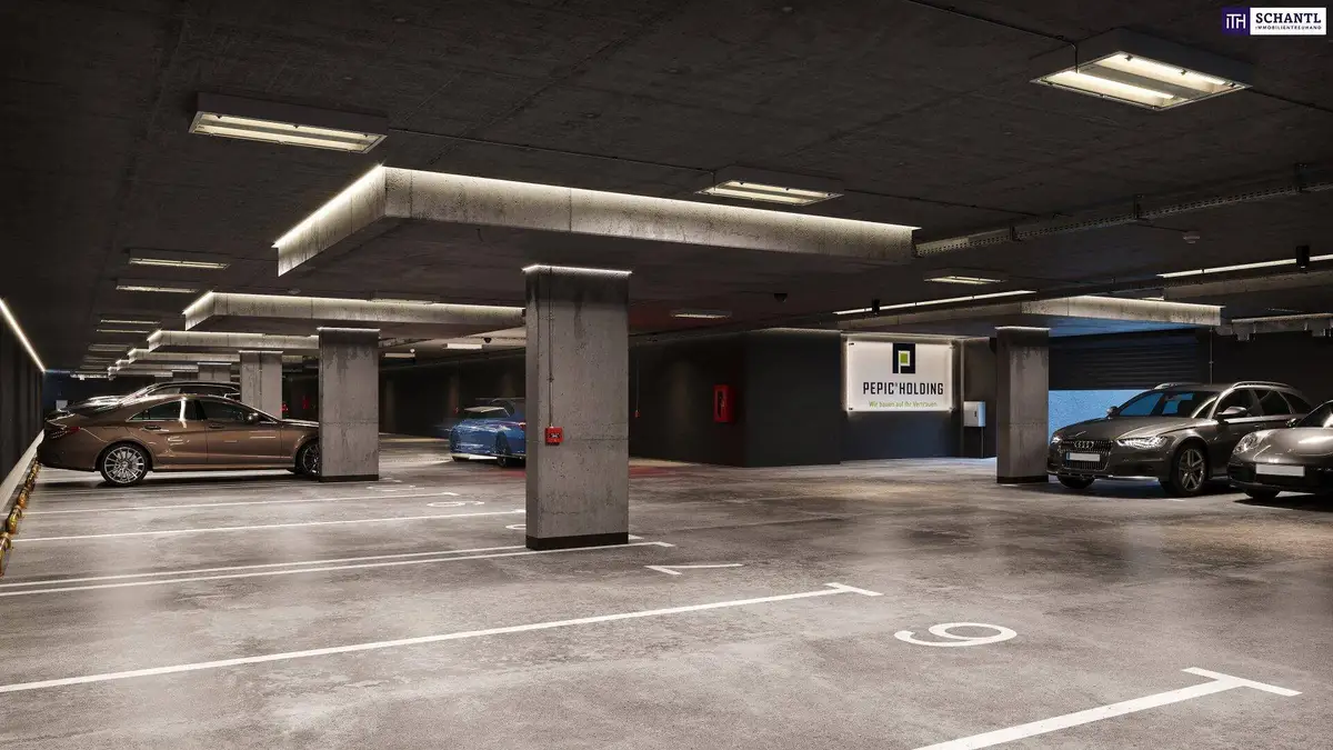 Tiefgarage mit mehreren Stellplätzen und moderner Beleuchtung.