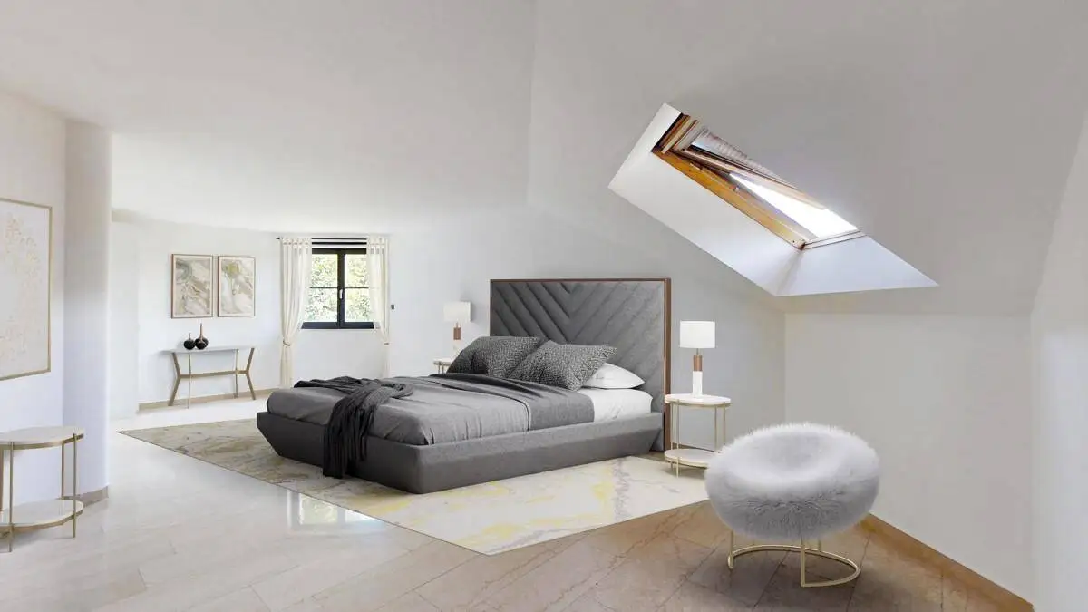 Helles Schlafzimmer im Dachgeschoss mit modernem Bett und großem Dachfenster.